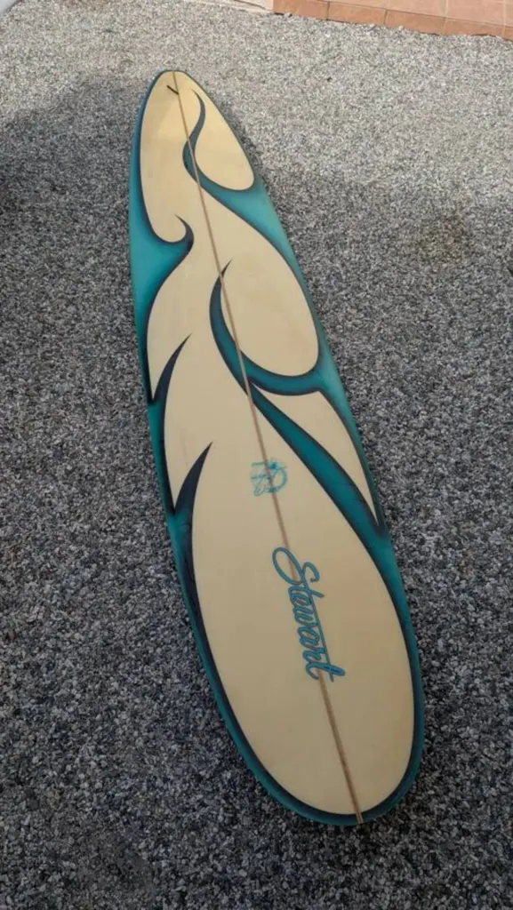 Stewart Surfboard With Teal 9' Longboard - Image 1